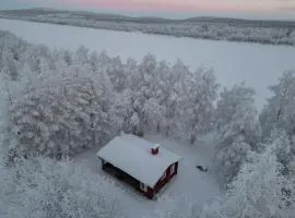 Log cabin on the banks of Ounasjoki River