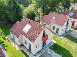 Sfeervol wellnesshuis met privé sauna en tuin，位于Ewijk的酒店