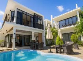 Villa Alizée Boutique Hotel - Idéal Couples & Pros - Rooftop - Parking privé - 10min Port-Louis