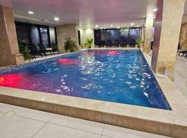 Bell Marina Apartments Pool & Spa Resort，位于北马马亚-讷沃达里的自助式住宿