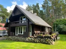 Cozy loghouse with sauna near a great sandy beach
