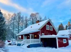 House near forest and water