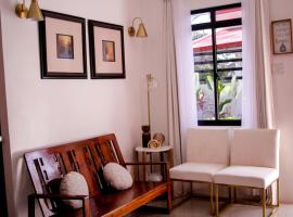 Secluded, Modern, Minimalist house - Gray House，位于Dampalan的酒店