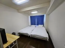 春日町 静かなマンションステイ ゆったり過ごせる一室