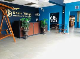 Oasis Wings Hotel，位于马纳尔的带停车场的酒店