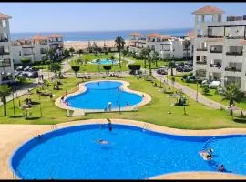 Beachfront Apartment in Assilah, Private Solarium, 4 Pools, Secure Residence, WiFi, Parking