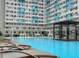 Cozy City Stay FREE Pool & Gym Access，位于Piapi的酒店
