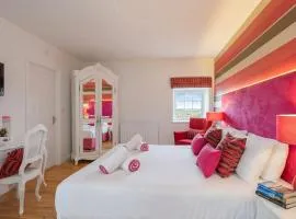 Bamburgh - Sleeps 8 - 3 Bedrooms 2 Bathrooms - 1 Bedroom Downstairs with Ensuite Bathroom - Secure Garden - Dogs Stay For Free - Stunning Beach Walks and Views - Log Fire - Outdoor Seating and Eating - Off Street Parking - Quiet Rural Location - Fast Wifi
