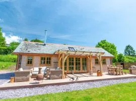 Idyllic countryside cabin with stream and lake