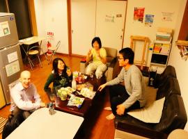 Osaka Tomato Guesthouse，位于大阪Nissin Food Products Co., Ltd.附近的酒店