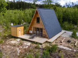 Cozy A-frame cottage surrounded by a magical panorama