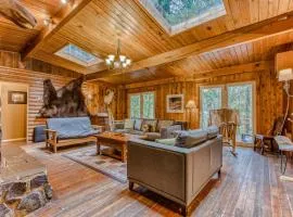 Rustic lodge with private hot tub fireplace & riverfront views - dog-friendly