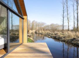 Tiny house by the water in Oud Ade - Tuin van Keet - 37，位于Oud-Ade的酒店