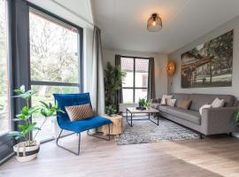 Prachtig & kindvriendelijk vakantiehuis aan recreatiemeer，位于Ewijk的酒店