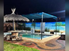 Casa con Piscina en Areguá，位于Capiatá的酒店