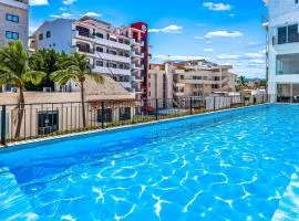 Bright coastal condo with pool access, private balcony & fast Wi-Fi