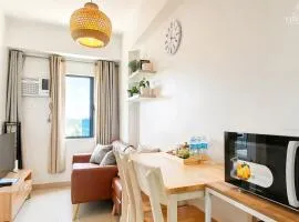 Cozy Japandi 2BR Condo Family Staycation with WIFI by Casa Luntian at The Leaf Residences