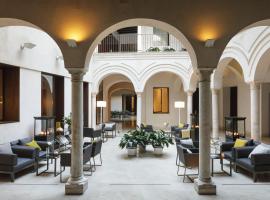 卢赛罗波萨达酒店，位于塞维利亚帕拉西奥拉斯杜埃尼亚斯博物馆附近的酒店