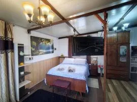 Loft with office, balcony, and grill
