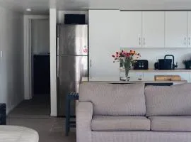 Stylish 1BR Retreat | Patio | Walk to Shops | Parking