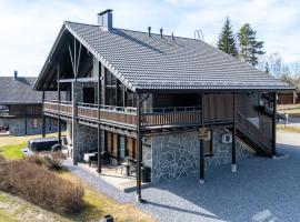 Himos Mökki superior - Chalet Cottage superior ski-in-ski-out，位于耶姆赛的酒店