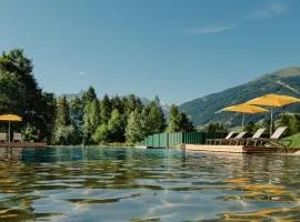 Hotel Norica - Thermenhotels Gastein mit dem Bademantel direkt in die Therme