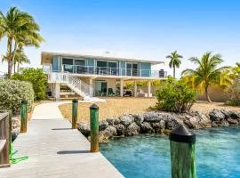 Dog-friendly beach escape with dock, furnished deck & bay views