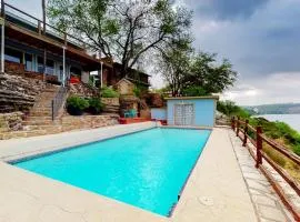 Mid-Century Modern Lake House with Private Waterfront Pool & Boat Dock