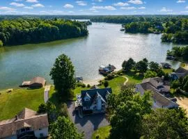 Lakefront retreat with views, hot tub, kid's play area, dock & fiber internet