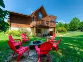 Three-story dog-friendly home with large deck, wood swing, firepit, lawn, & more