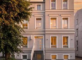 LIGHTHOUSE APPARTEMENTS - Premium Ferienwohnungen in ruhiger, zentraler Lage，位于瓦尔内明德的酒店