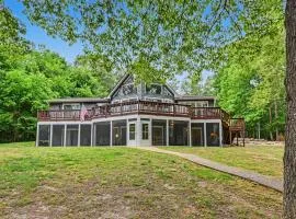 Spacious waterfront escape with screened porch, water slide, & games
