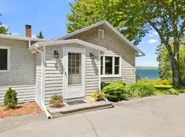 Charming home with stunning bay views, sunroom, gazebo, deck, & grill