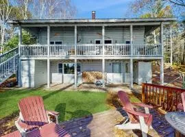Charming riverfront home with cozy interiors, dock, and scenic deck views