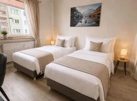 2min Fußweg vom Bahnhof, Ferienwohnung mit Balkon, Wifi, Smart TV, Hotel-Boxspringbetten