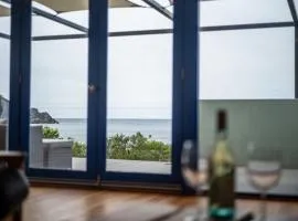 Unique beachfront retreat w panoramic sea views