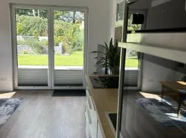 Moderne 1-Zimmer-Gästewohnung im Neubau mit schönem Garten