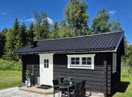 Mysig timmerstuga på dalagård