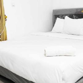 Pertiwi Homestay Near Museum Angkut Batu Mitra RedDoorz，位于玛琅的酒店
