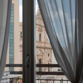 Central House palazzo Brafa una camera di albergo，位于伊斯皮卡的酒店