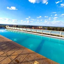 A beautiful one bedroom with a rooftop pool