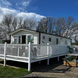 Sandy Bay Caravan Getaway，位于滨海纽比金的酒店