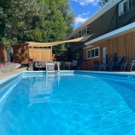 Bright poolside walkout two bedroom basement suite in the Okanagan