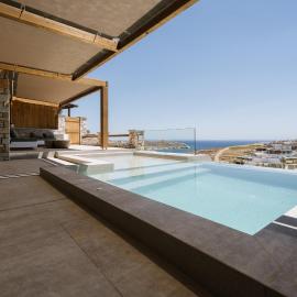 Ios Sea view apartment with pool 2B，位于伊奥斯乔拉的酒店