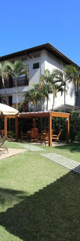 Hotel Ilhas do Caribe - Na melhor região da Praia da Enseada，位于瓜鲁雅的酒店