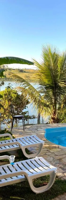 Casa com piscina fundo pra represa e AR Condicionado CasinhaBrancaDeVaranda，位于Ijaci的酒店