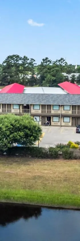 玉兰行政套房汽车旅馆，位于马格诺利亚的酒店