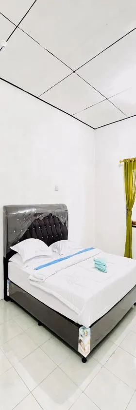 Kempu Tigan Homestay Berastagi Mitra RedDoorz，位于不拉士打宜的酒店