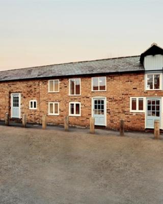 THE COACHING BARNS