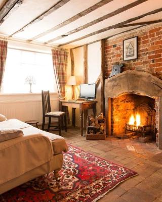 Spadgers, a flax workers cottage next to fields in a Medieval Village